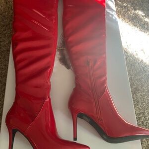 Jessica Simpson over the knee red patent leather boots-new and never worn.